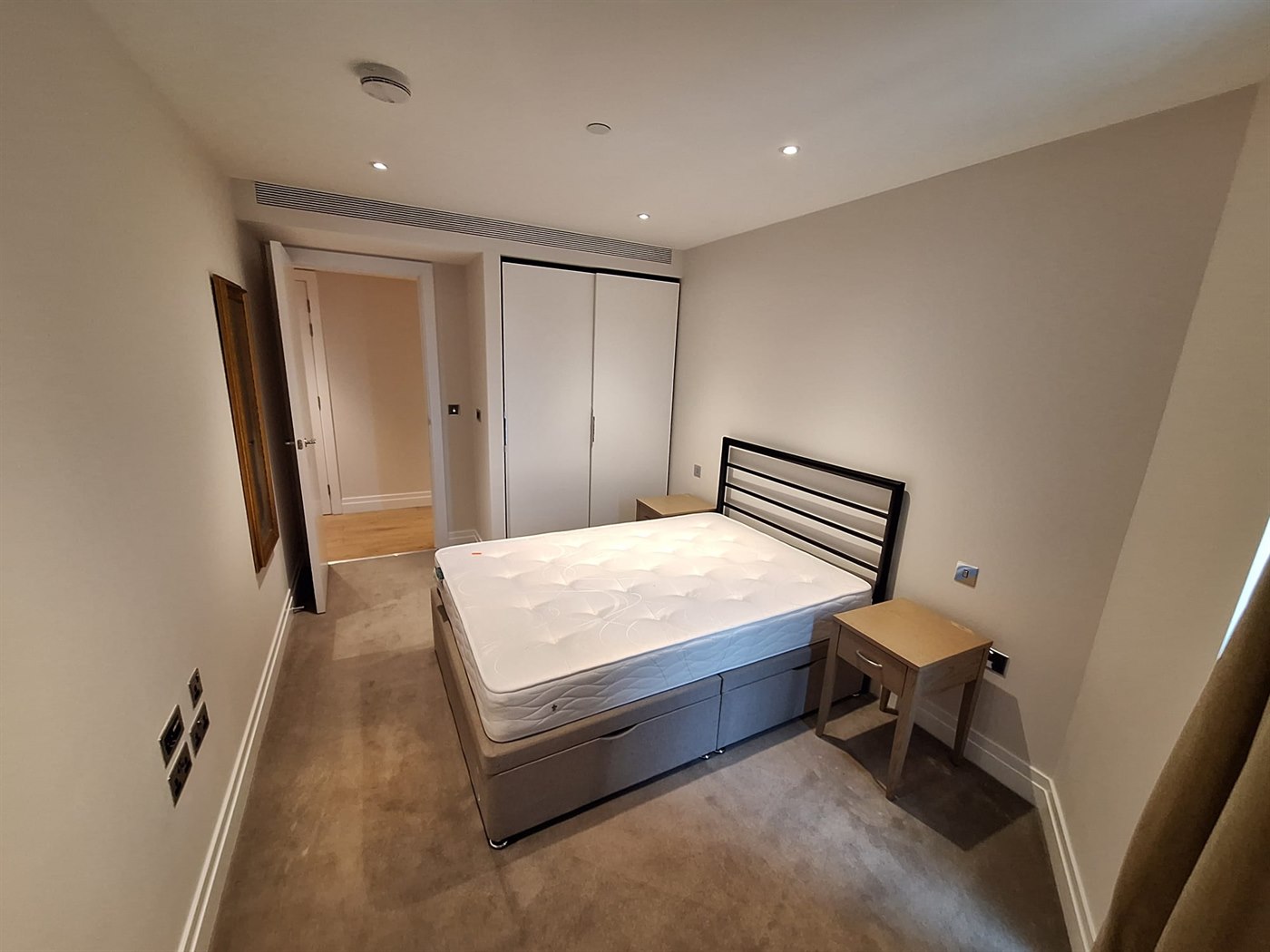 Freshly painted bedroom in SW11 apartment with clean wall coverage and consistent trim