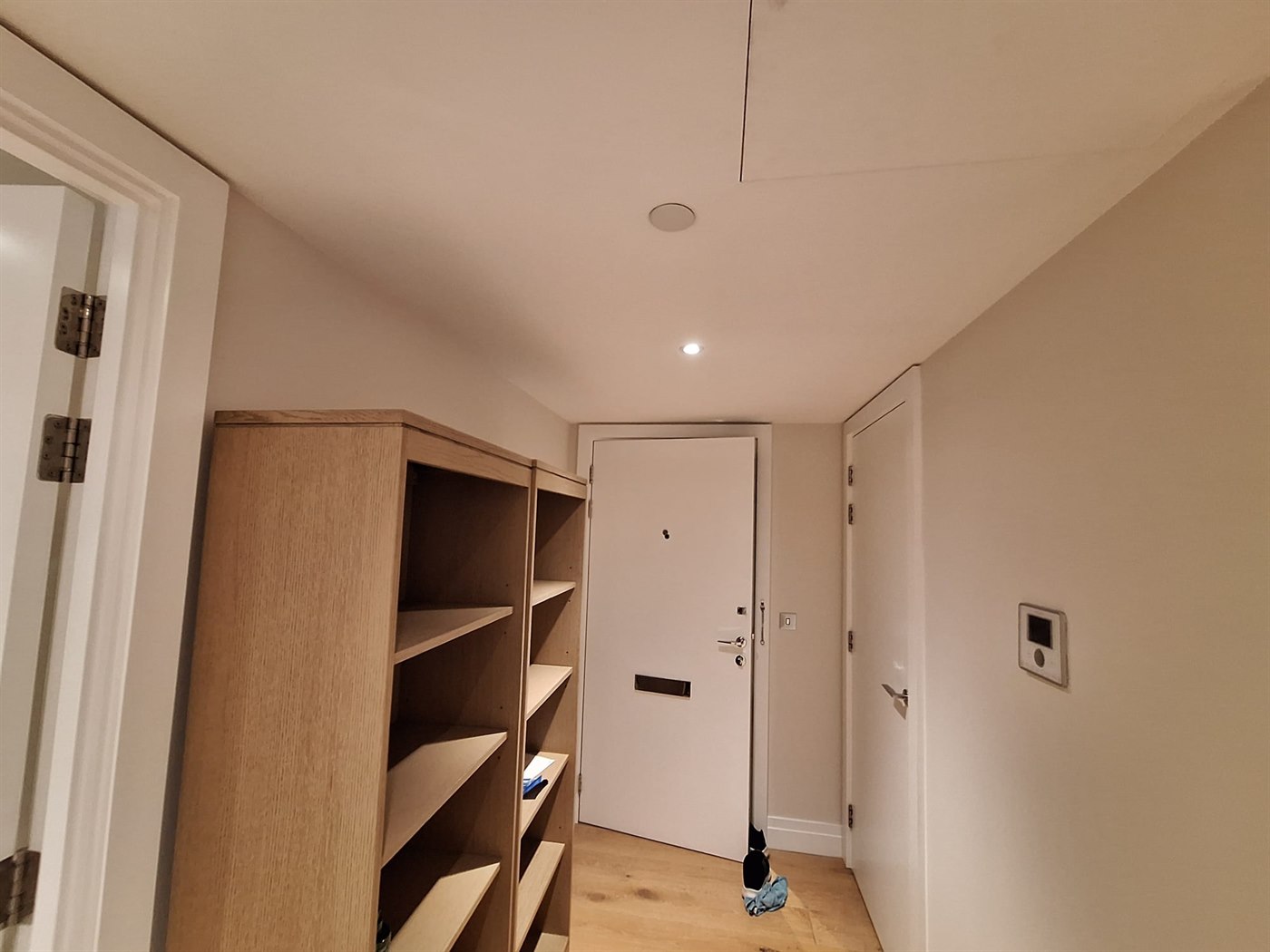 Apartment entry area in SW11 London with painted walls, ceiling, and bright white woodwork