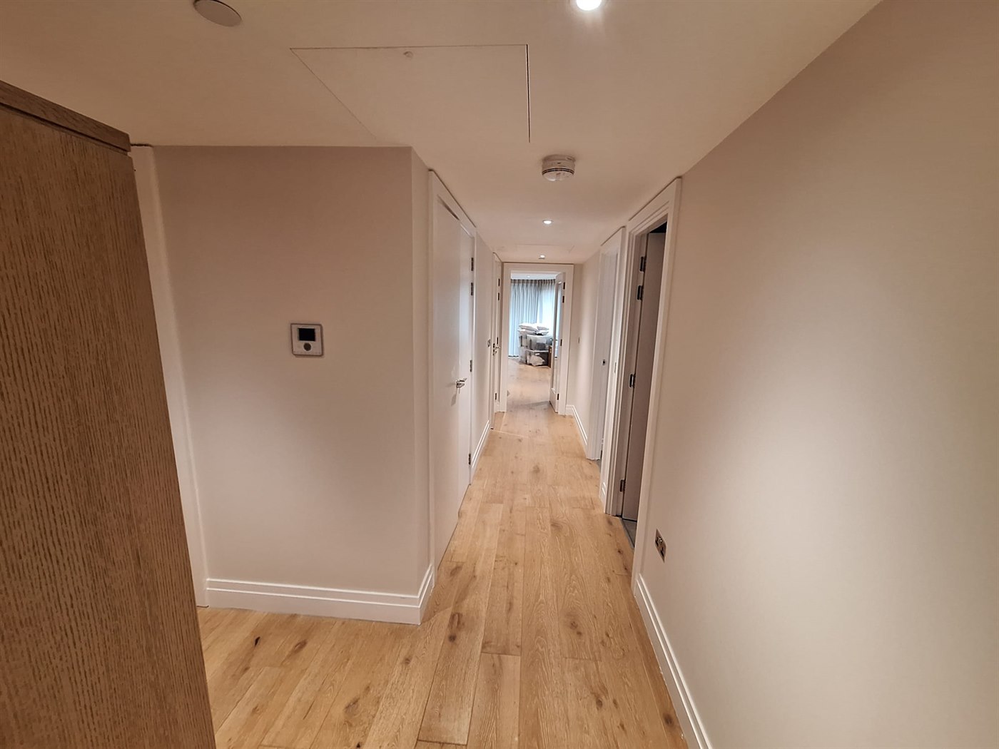 Hallway repaint in SW11 apartment with clean walls, ceiling, skirting, and door frames